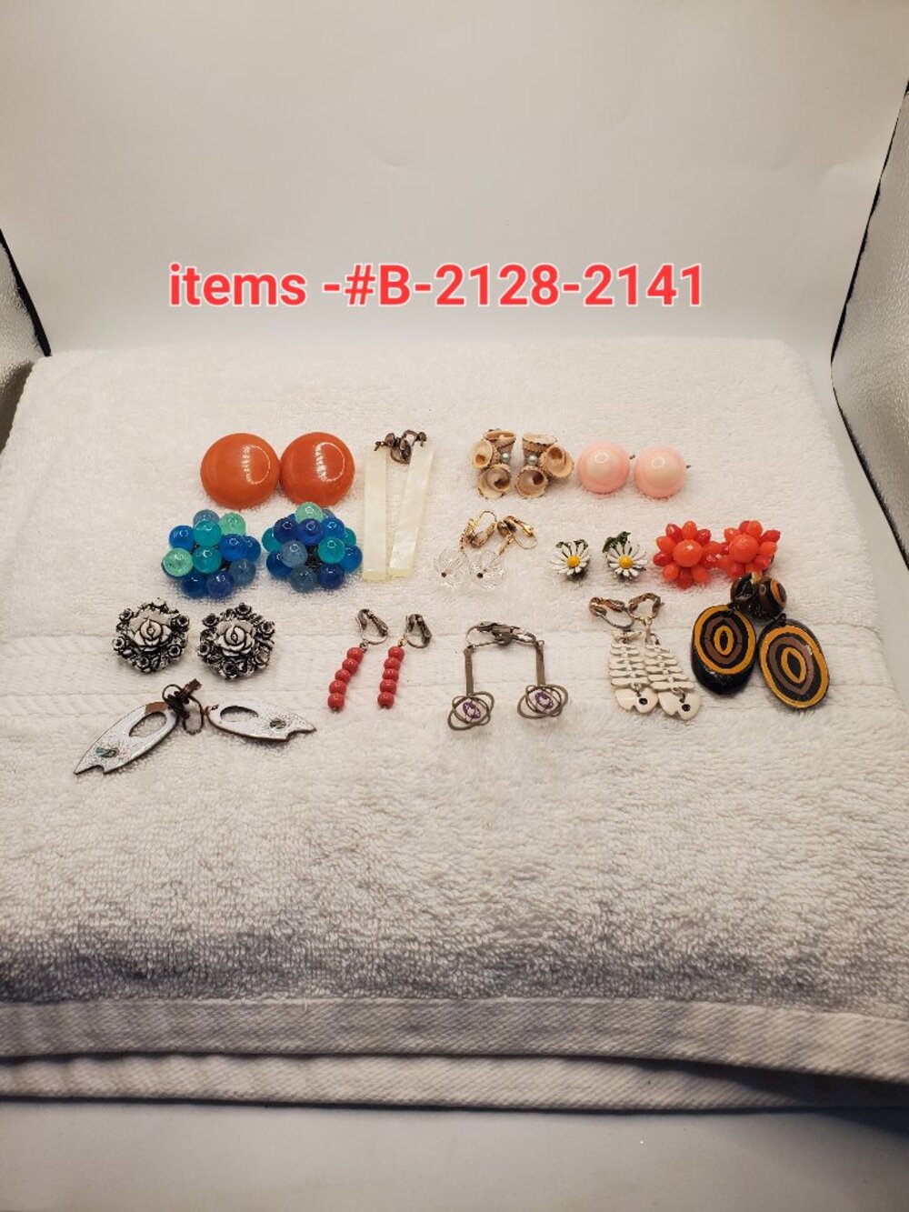 14 Pair of clip on earrings, items # B -2128-2141,.   wt. 127 grams.